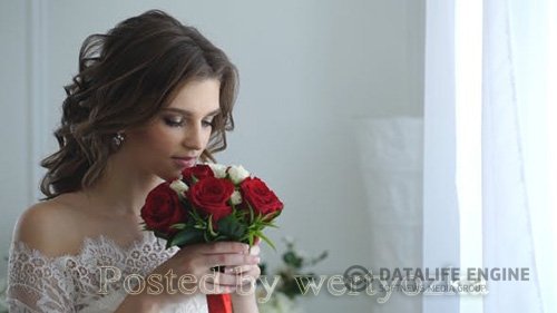 Beautiful Bride Smelling Wedding Bouquet